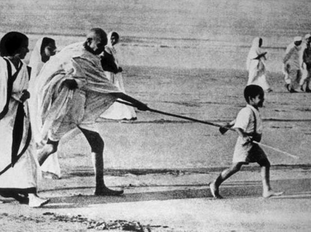 Kanu Gandhi walking ahead of Mahatma